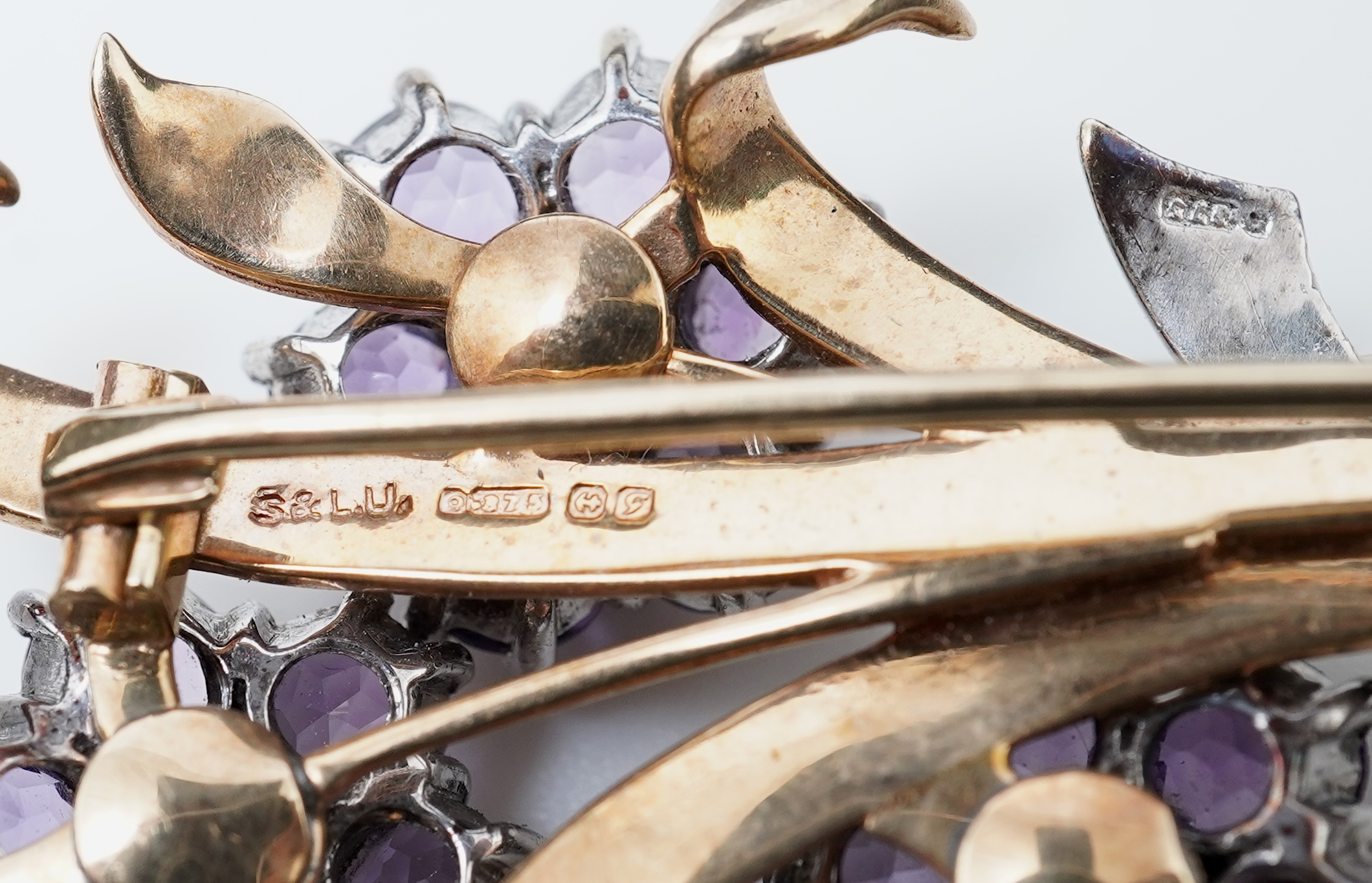 A Retro amethyst and diamond brooch, circa 1956